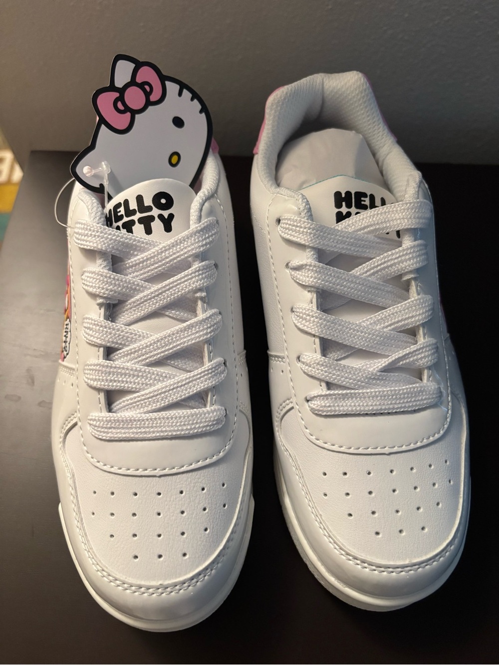 Hello Kitty White Sneakers with Pink & Patent Acents and Rainbow Graphic
Size 2
